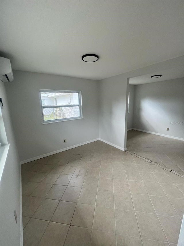 6130 Gamble Dr, Orlando, FL 32808 - unfurnished room featuring tile patterned floors, baseboards, and a wall mounted AC