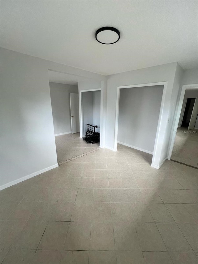6130 Gamble Dr, Orlando, FL 32808 - unfurnished living room with baseboards