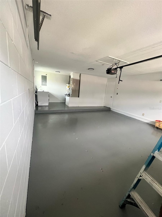 6130 Gamble Dr, Orlando, FL 32808 - garage with concrete block wall and a garage door opener