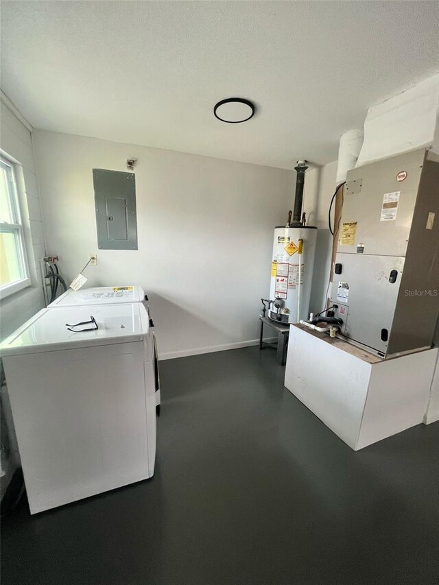 6130 Gamble Dr, Orlando, FL 32808 - kitchen with baseboards, finished concrete floors, gas water heater, electric panel, and independent washer and dryer