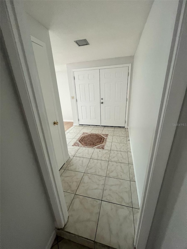 6130 Gamble Dr, Orlando, FL 32808 - corridor with baseboards and marble finish floor