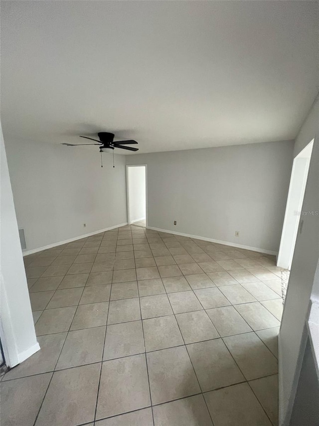 6130 Gamble Dr, Orlando, FL 32808 - unfurnished room with light tile patterned flooring, baseboards, and ceiling fan