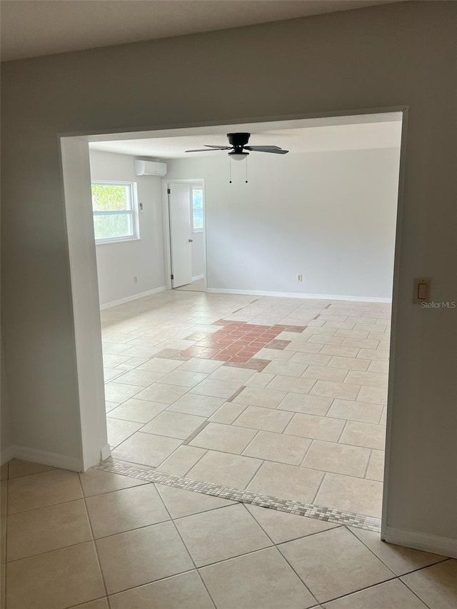 6130 Gamble Dr, Orlando, FL 32808 - spare room with ceiling fan, light tile patterned flooring, baseboards, and a wall mounted AC