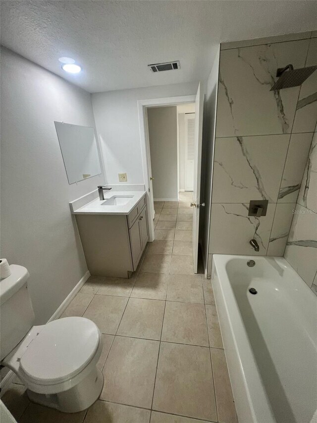 6130 Gamble Dr, Orlando, FL 32808 - full bathroom with visible vents, toilet, a textured ceiling, tile patterned flooring, and vanity