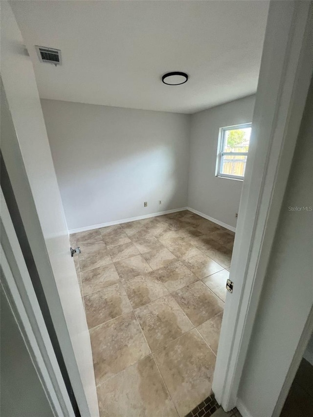 6130 Gamble Dr, Orlando, FL 32808 - empty room featuring visible vents and baseboards
