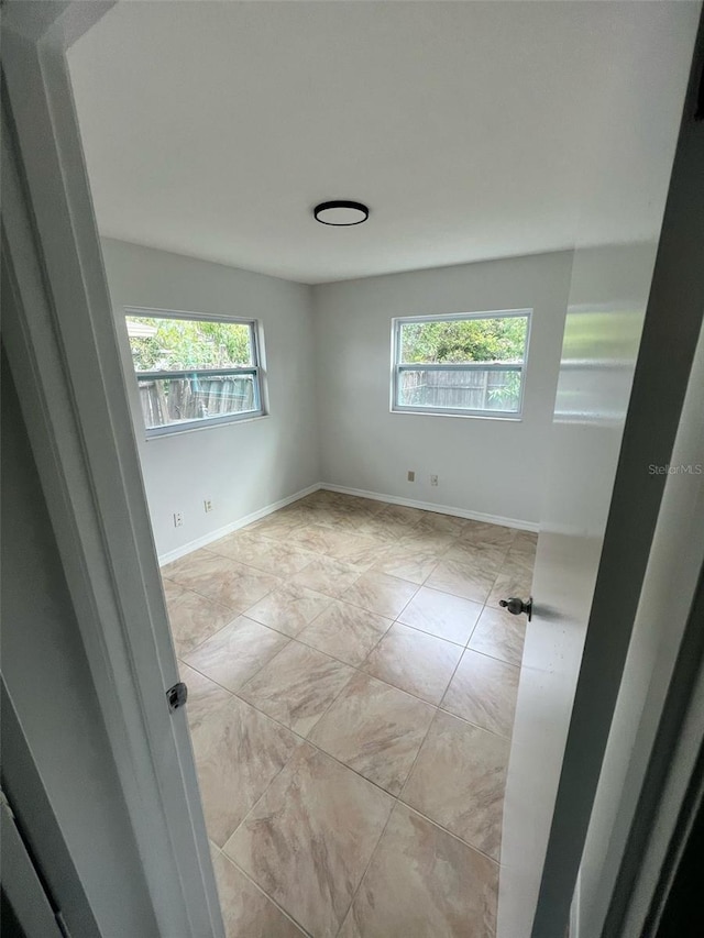 6130 Gamble Dr, Orlando, FL 32808 - spare room featuring baseboards