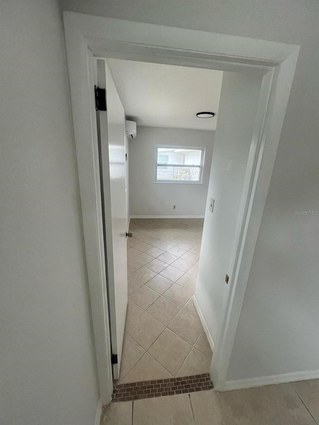 6130 Gamble Dr, Orlando, FL 32808 - corridor featuring light tile patterned flooring, baseboards, and a wall mounted AC