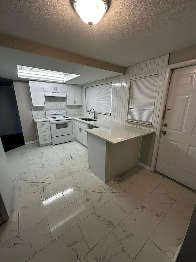 kitchen with a sink, a peninsula, marble finish floor, and white electric stove