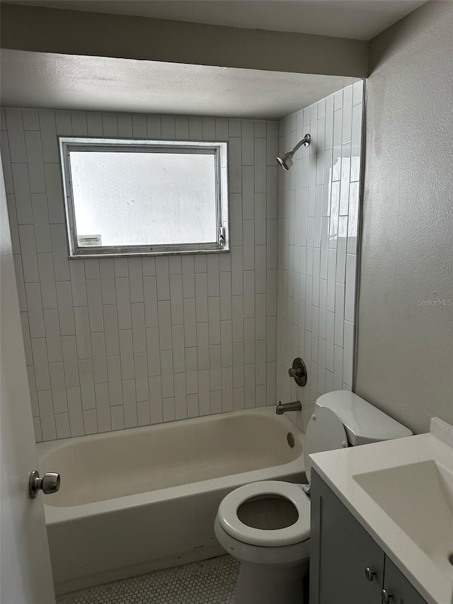 bathroom featuring tile patterned floors, vanity, toilet, and shower / bathing tub combination