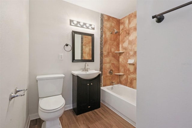 full bathroom with vanity, toilet, baseboards, shower / tub combination, and wood finished floors
