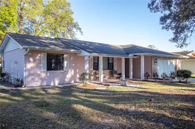 613 Andrew St, Altamonte Springs, FL 32714 - ranch-style home featuring a garage, a porch, and a front yard