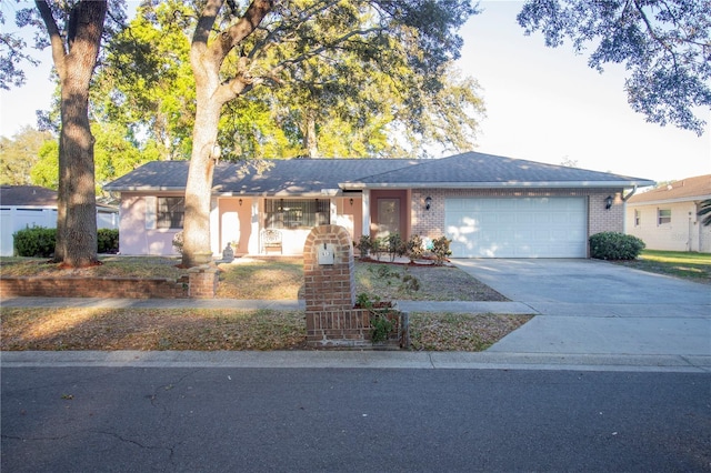 613 Andrew St, Altamonte Springs, FL 32714 - single story home with a garage, driveway, brick siding, and fence