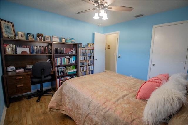 613 Andrew St, Altamonte Springs, FL 32714 - bedroom featuring wood finished floors, a desk, and ceiling fan