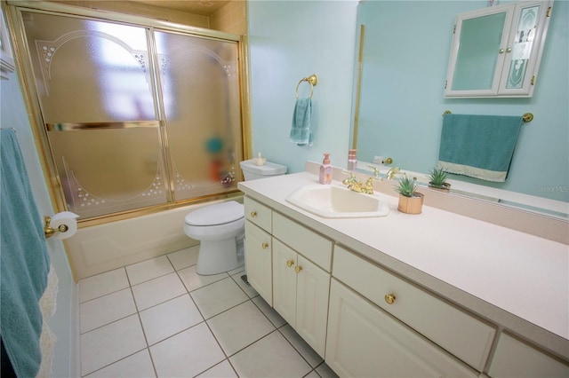613 Andrew St, Altamonte Springs, FL 32714 - bathroom with tile patterned floors, toilet, vanity, and enclosed tub / shower combo