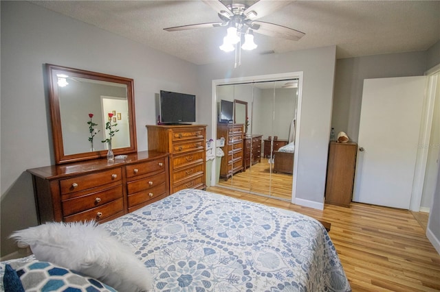 613 Andrew St, Altamonte Springs, FL 32714 - bedroom featuring light wood-type flooring, a closet, ceiling fan, a textured ceiling, and baseboards