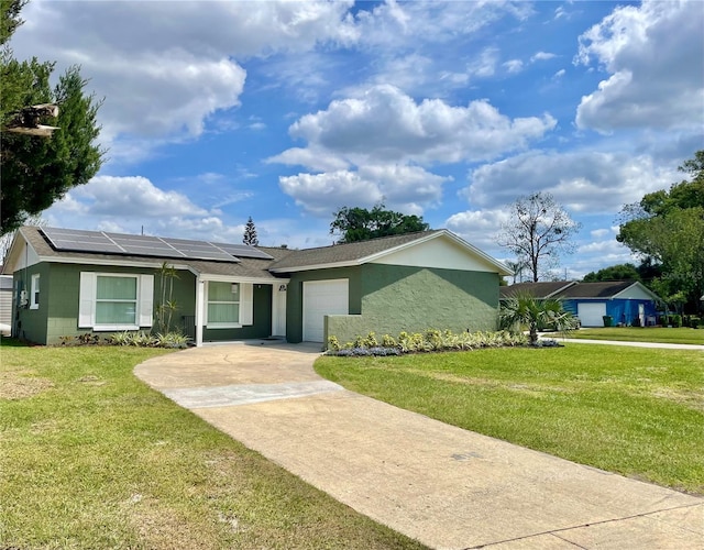 714 W Ct, Longwood, FL 32750 - single story home with roof mounted solar panels, concrete block siding, a front lawn, a garage, and driveway