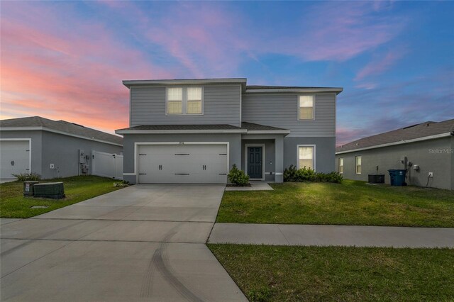 1506 Finnigan Cir, Haines City, FL 33844 - traditional-style home with cooling unit, concrete driveway, a front yard, and a shingled roof