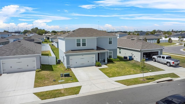 1506 Finnigan Cir, Haines City, FL 33844 - traditional home with a garage, a residential view, a front yard, and a shingled roof