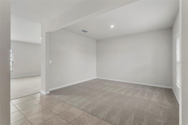 1506 Finnigan Cir, Haines City, FL 33844 - tiled empty room with recessed lighting, baseboards, visible vents, and carpet floors