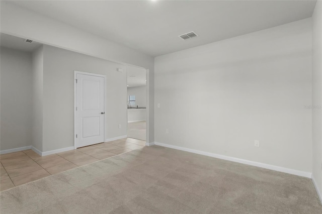 1506 Finnigan Cir, Haines City, FL 33844 - empty room with tile patterned flooring, visible vents, baseboards, and carpet floors