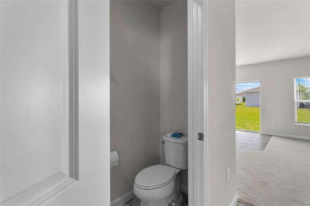 1506 Finnigan Cir, Haines City, FL 33844 - bathroom featuring toilet and baseboards
