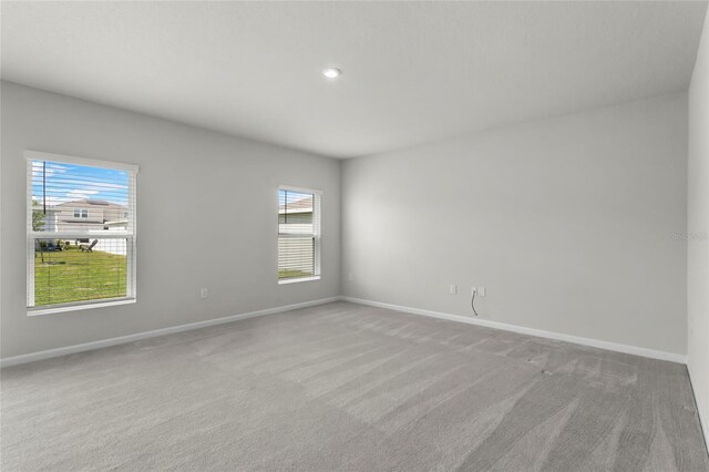 1506 Finnigan Cir, Haines City, FL 33844 - carpeted spare room featuring baseboards