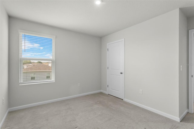 1506 Finnigan Cir, Haines City, FL 33844 - spare room with baseboards and light colored carpet