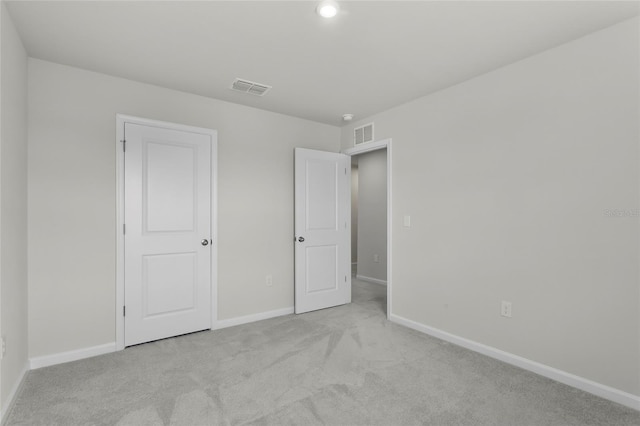 1506 Finnigan Cir, Haines City, FL 33844 - unfurnished bedroom with visible vents, baseboards, and light colored carpet