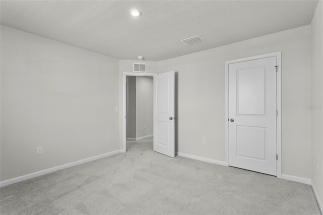 1506 Finnigan Cir, Haines City, FL 33844 - unfurnished bedroom featuring visible vents, baseboards, and carpet floors