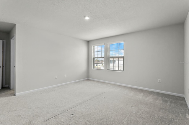 1506 Finnigan Cir, Haines City, FL 33844 - carpeted empty room featuring a textured ceiling and baseboards