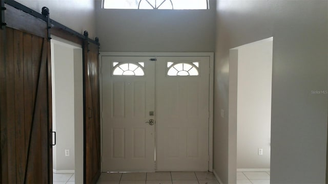1760 Imperial Palm Dr, Apopka, FL 32712 - foyer entrance featuring plenty of natural light, a high ceiling, and light tile patterned floors