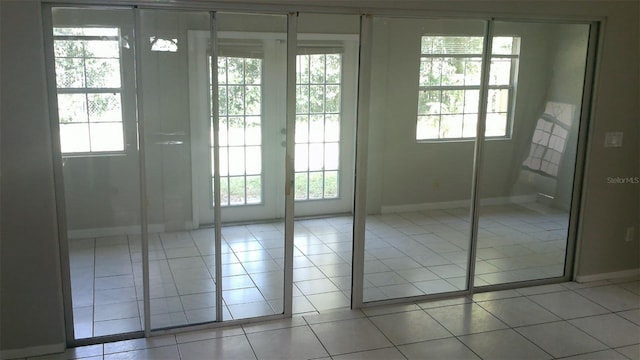 1760 Imperial Palm Dr, Apopka, FL 32712 - entryway with plenty of natural light, baseboards, and light tile patterned floors