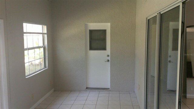 1760 Imperial Palm Dr, Apopka, FL 32712 - unfurnished room with plenty of natural light and light tile patterned floors