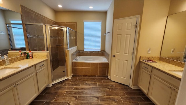 2749 Sand Oak Loop, Apopka, FL 32712 - full bathroom featuring a garden tub, two vanities, a stall shower, and recessed lighting