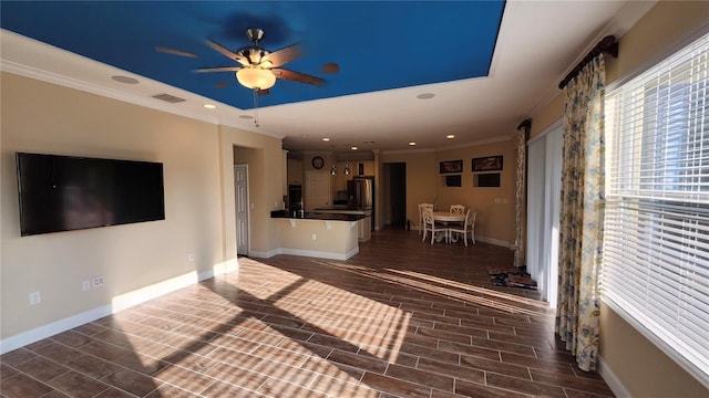 2749 Sand Oak Loop, Apopka, FL 32712 - unfurnished living room with ornamental molding, a ceiling fan, recessed lighting, a barn door, and wood finished floors