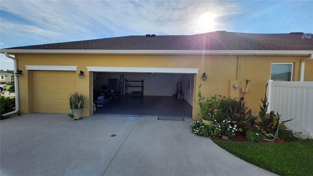 2749 Sand Oak Loop, Apopka, FL 32712 - view of property exterior featuring stucco siding, a garage, and concrete driveway