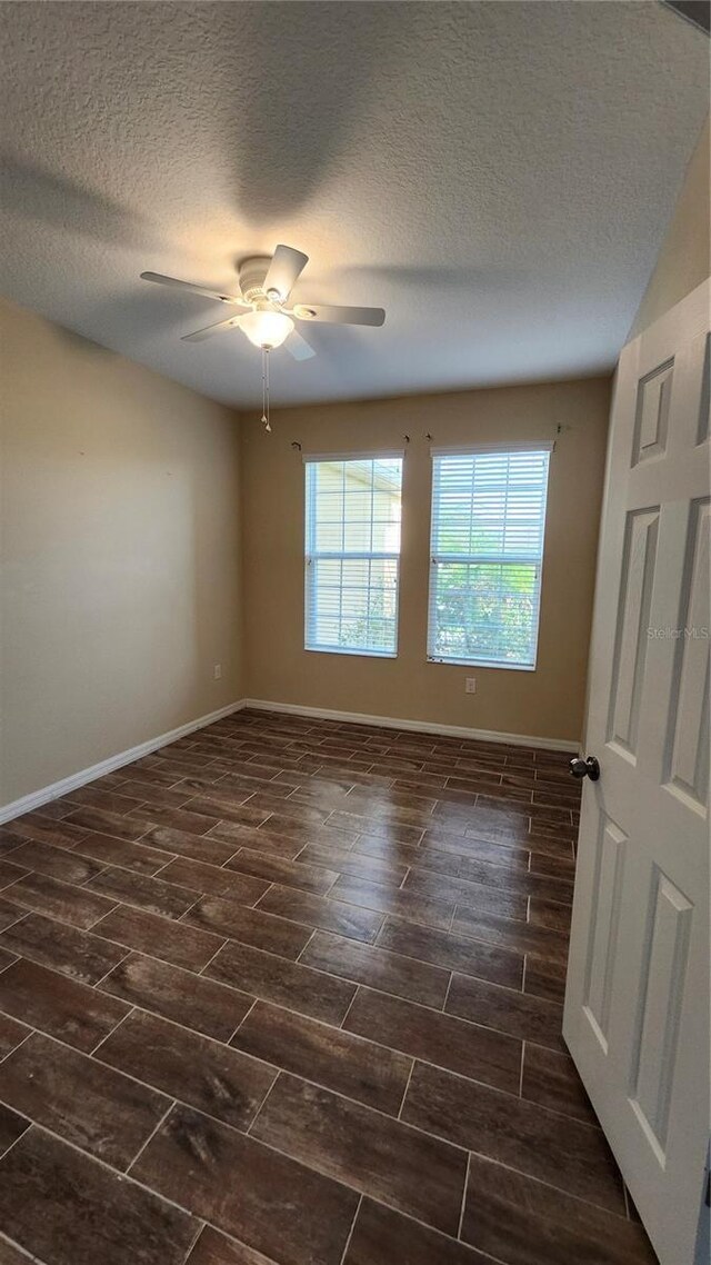 2749 Sand Oak Loop, Apopka, FL 32712 - spare room with a textured ceiling, a ceiling fan, and wood tiled floors