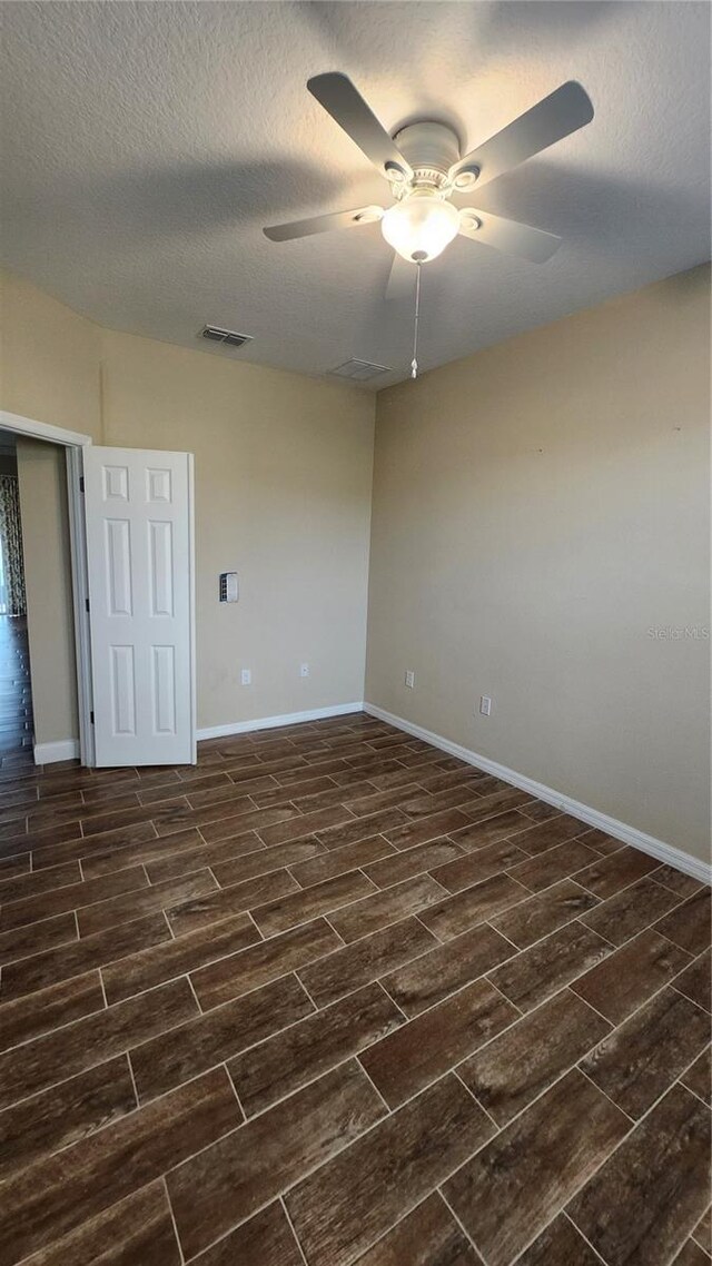 2749 Sand Oak Loop, Apopka, FL 32712 - empty room with a ceiling fan, wood tiled floors, and a textured ceiling