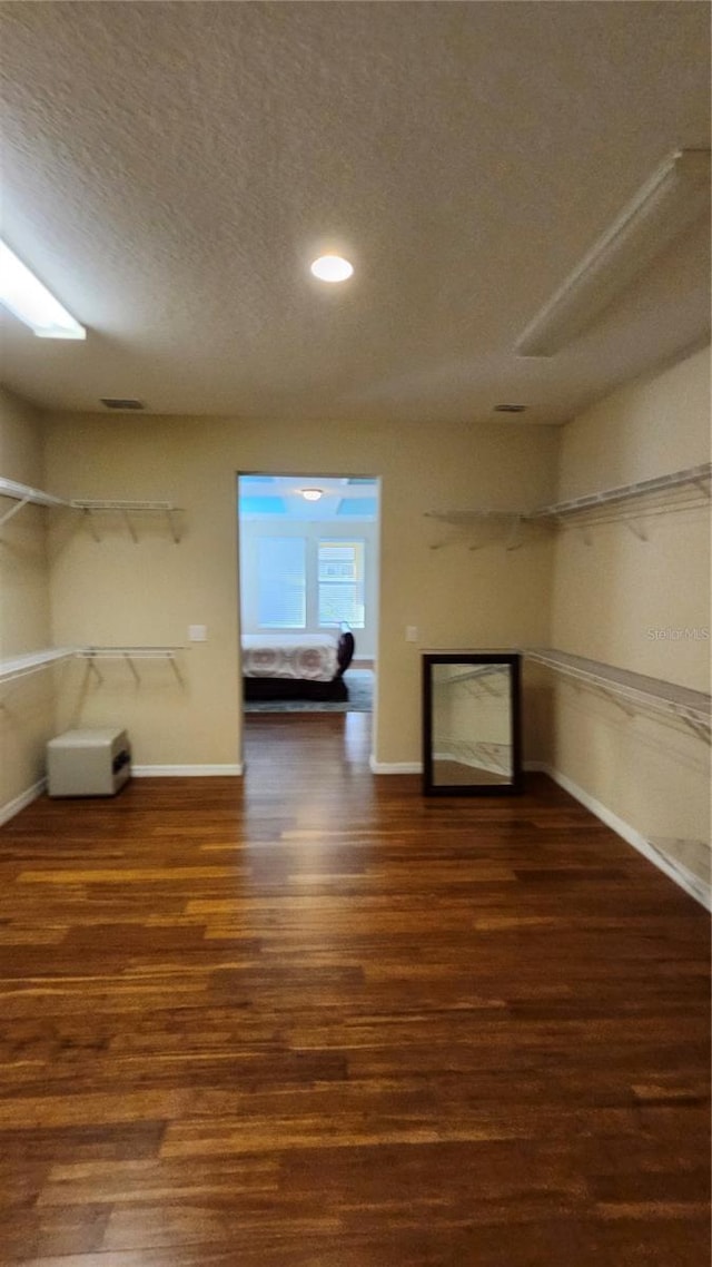 2749 Sand Oak Loop, Apopka, FL 32712 - unfurnished living room with a textured ceiling, wood finished floors, a fireplace, and recessed lighting