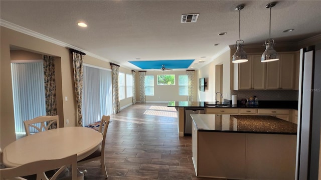 2749 Sand Oak Loop, Apopka, FL 32712 - kitchen featuring dishwasher, a peninsula, crown molding, backsplash, and recessed lighting