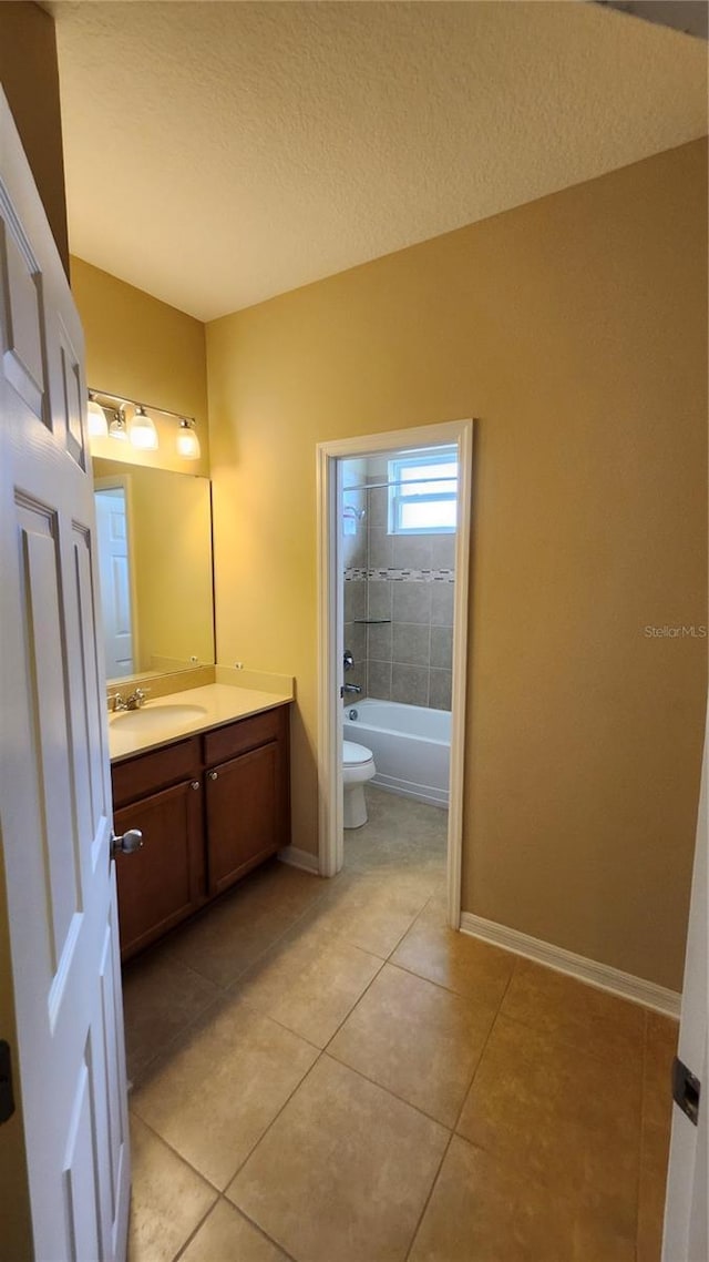 2749 Sand Oak Loop, Apopka, FL 32712 - full bathroom featuring vanity, tile patterned floors, a textured ceiling, and shower / tub combination