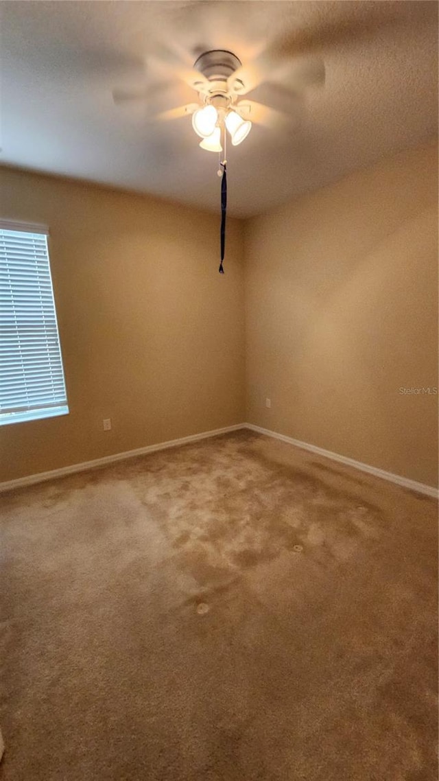 2749 Sand Oak Loop, Apopka, FL 32712 - carpeted spare room featuring baseboards and a ceiling fan