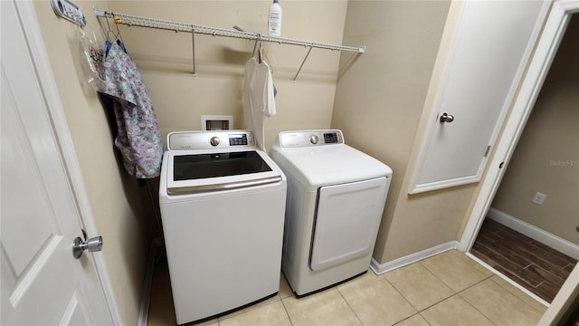 2749 Sand Oak Loop, Apopka, FL 32712 - laundry area featuring washer and dryer and light tile patterned floors