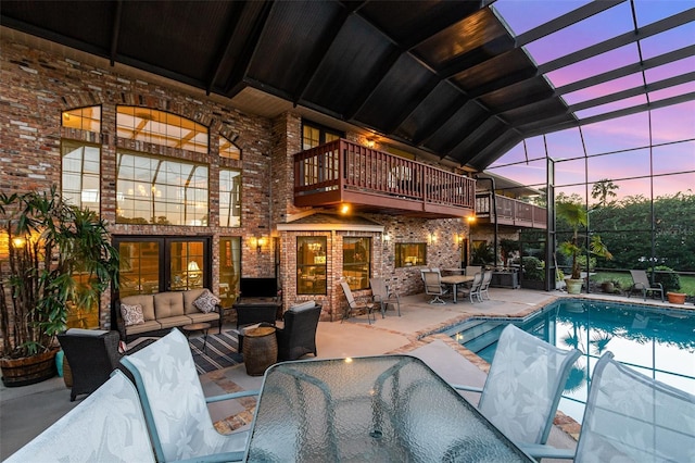 132 Pleasant Valley Dr, Daytona Beach, FL 32114 - exterior space with an outdoor living space, glass enclosure, a balcony, outdoor dining space, and an outdoor pool
