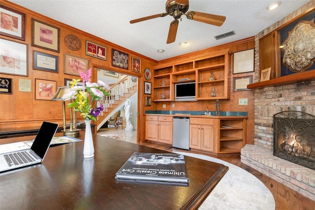132 Pleasant Valley Dr, Daytona Beach, FL 32114 - interior space with visible vents, a ceiling fan, open shelves, a textured ceiling, and a brick fireplace