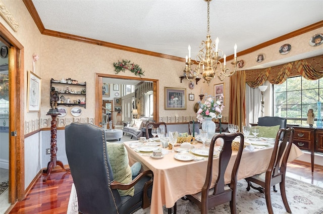 132 Pleasant Valley Dr, Daytona Beach, FL 32114 - dining room with wood finished floors, wallpapered walls, an inviting chandelier, a textured ceiling, and crown molding