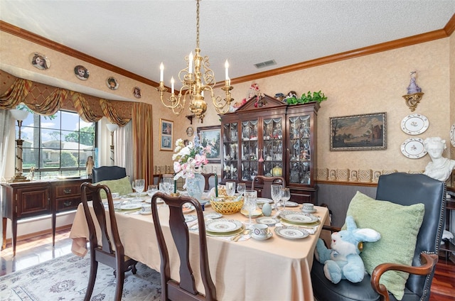 132 Pleasant Valley Dr, Daytona Beach, FL 32114 - dining room with wallpapered walls, a textured ceiling, a notable chandelier, and ornamental molding