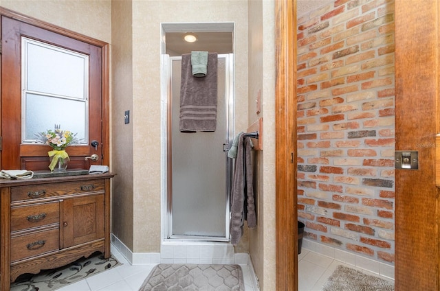 132 Pleasant Valley Dr, Daytona Beach, FL 32114 - bathroom with tile patterned flooring, a stall shower, and baseboards