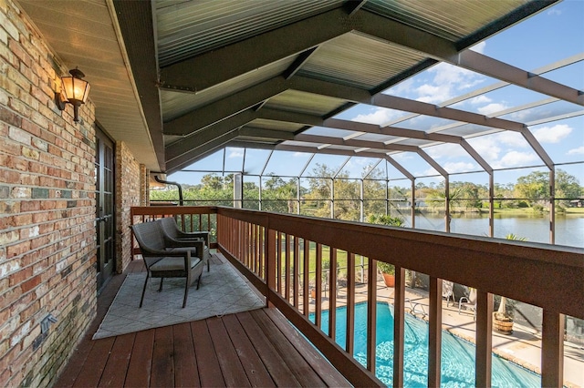 132 Pleasant Valley Dr, Daytona Beach, FL 32114 - wooden terrace featuring glass enclosure, an outdoor pool, a patio, and a water view