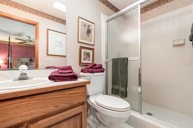 132 Pleasant Valley Dr, Daytona Beach, FL 32114 - bathroom featuring a shower stall, wallpapered walls, toilet, vanity, and a textured ceiling